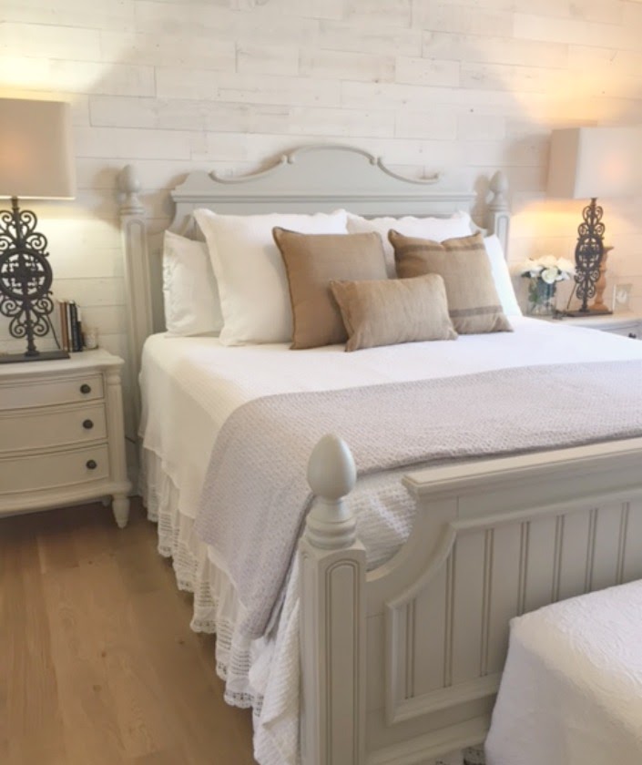Nordic French white bedroom with light grey, linen, and white. Stikwood on wall, alder doors, cottage style furniture, and white oak flooring. #hellolovelystudio #bedroom #frenchcountry #nordicfrench #stikwood #serene #romantic #whitebedroom