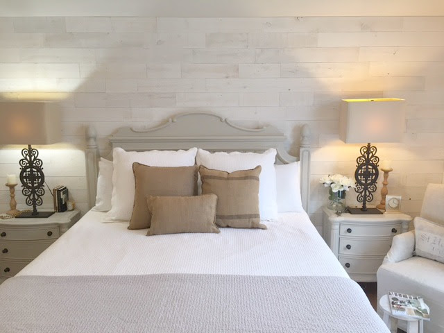 Nordic French white bedroom with light grey, linen, and white. Stikwood on wall, alder doors, cottage style furniture, and white oak flooring. #hellolovelystudio #bedroom #frenchcountry #nordicfrench #stikwood #serene #romantic #whitebedroom