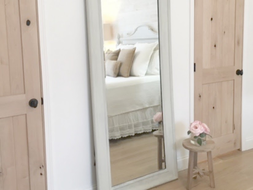 Nordic French white bedroom with light grey, linen, and white. Stikwood on wall, alder doors, cottage style furniture, and white oak flooring. #hellolovelystudio #bedroom #frenchcountry #nordicfrench #stikwood #serene #romantic #whitebedroom