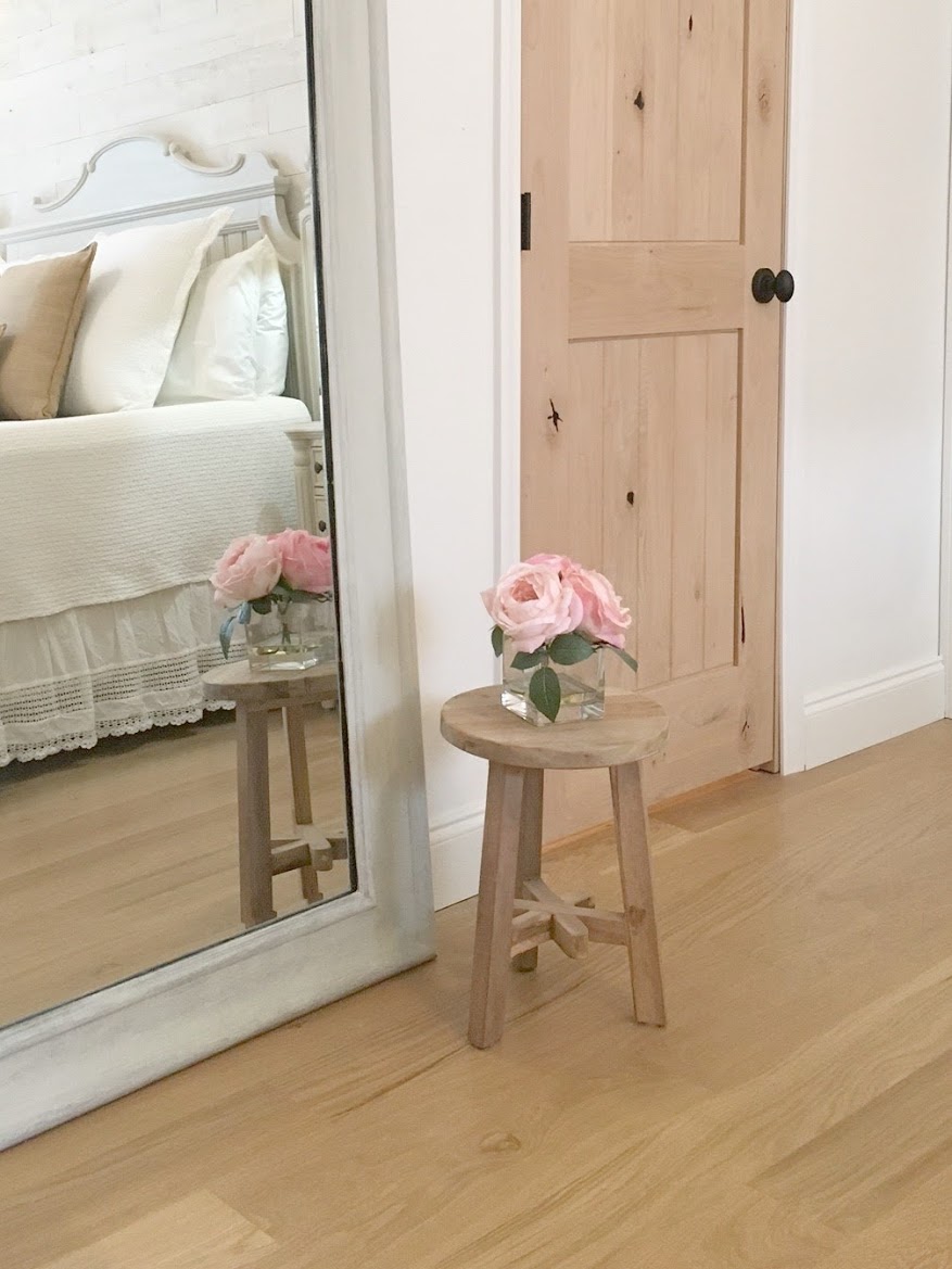 Nordic French white bedroom with light grey, linen, and white. Stikwood on wall, alder doors, cottage style furniture, and white oak flooring. #hellolovelystudio #bedroom #frenchcountry #nordicfrench #stikwood #serene #romantic #whitebedroom