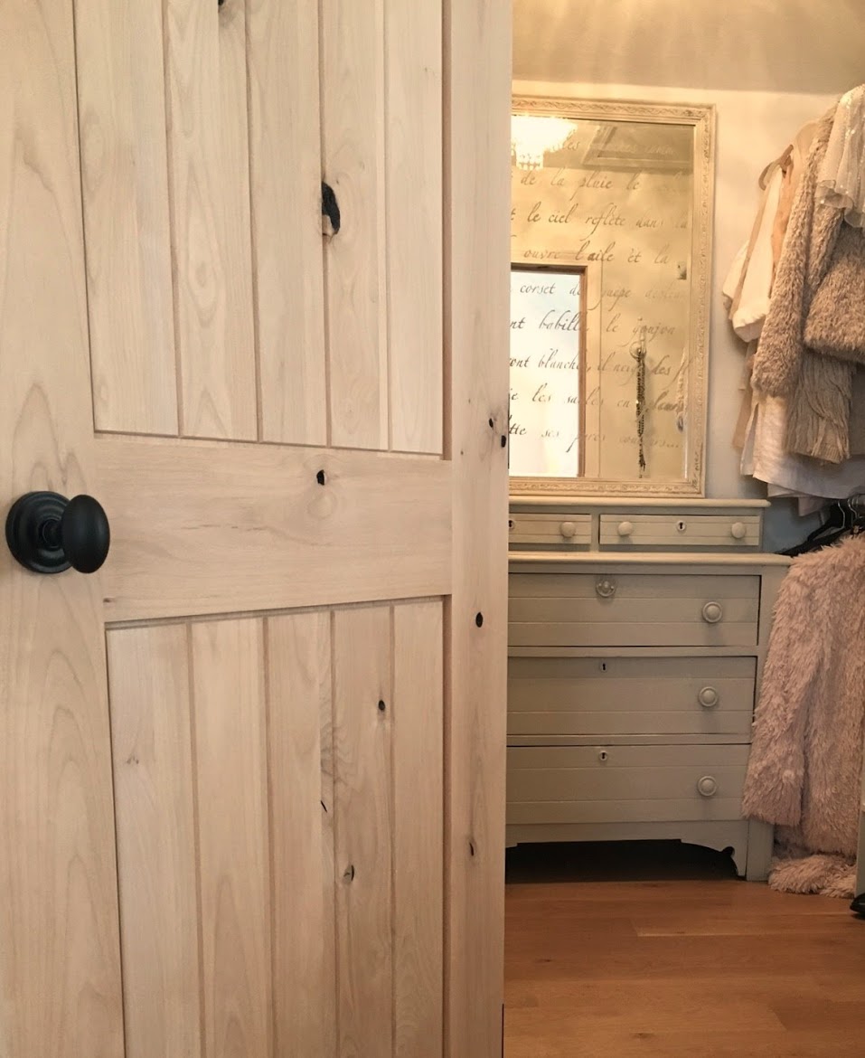 Nordic French white bedroom with light grey, linen, and white. Stikwood on wall, alder doors, cottage style furniture, and white oak flooring. #hellolovelystudio #bedroom #frenchcountry #nordicfrench #stikwood #serene #romantic #whitebedroom