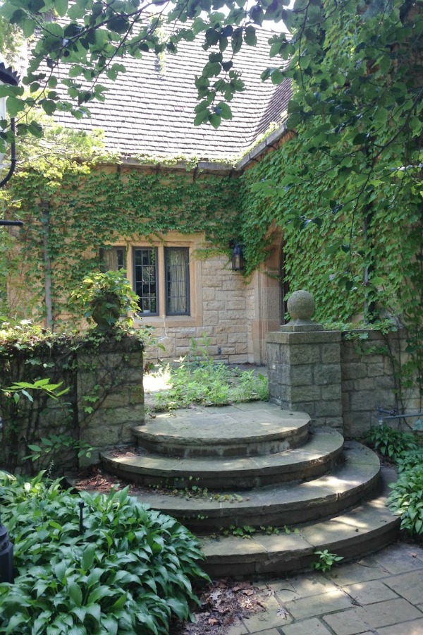 French country house exterior with climbing vnes and old stone. Hello Lovely Studio. #frenchcountry #frenchfarmhouse #climbingvines #hellolovelystudio