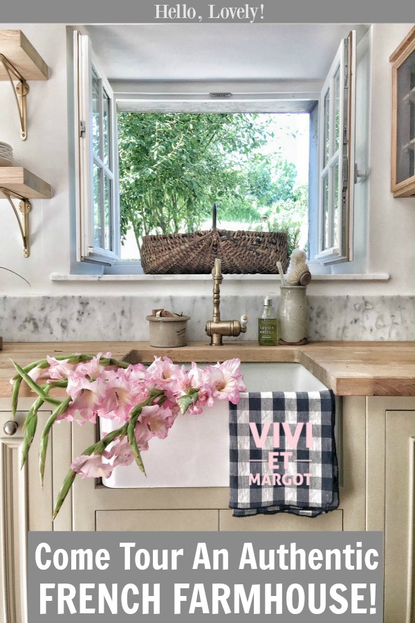 A renovated kitchen in a 150 year old country house in France has charming windows at the farm sink. #vivietmargot #kitchendesign #frenchfarmhouse #rusticdecor #farmsink