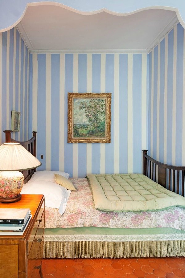 Periwinkle blue and mint green striped wallpaper in a traditional French country bedroom in Provence - Haven In. #frenchcountry #stripes #bedroom
