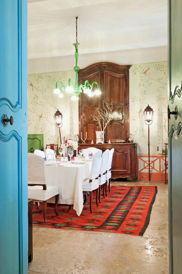 Old World style, bright green accents, and handpainted walls in the dining room of a traditional home in Provence. #frenchcountry #diningroom