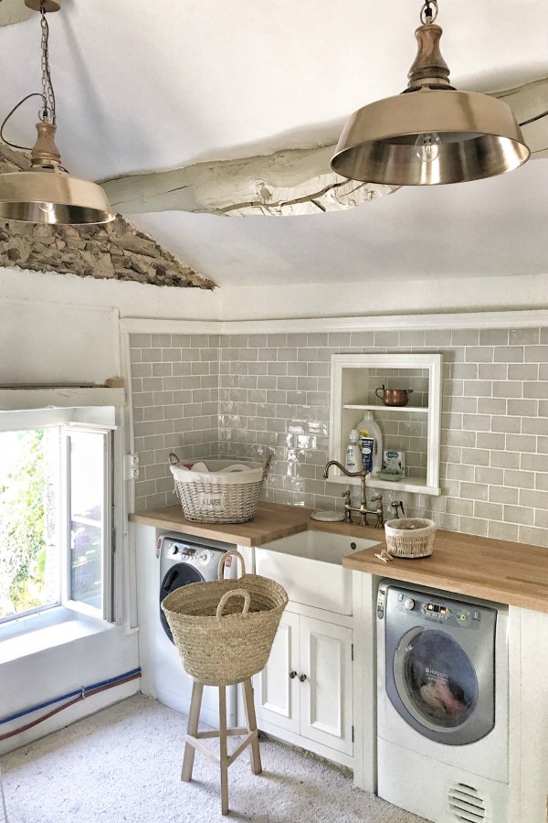 Farmhouse style laundry room with grey subway tile and farm sink. #frenchcountry #vivietmargot #laundryroom #romanticdecor #farmhousedecor