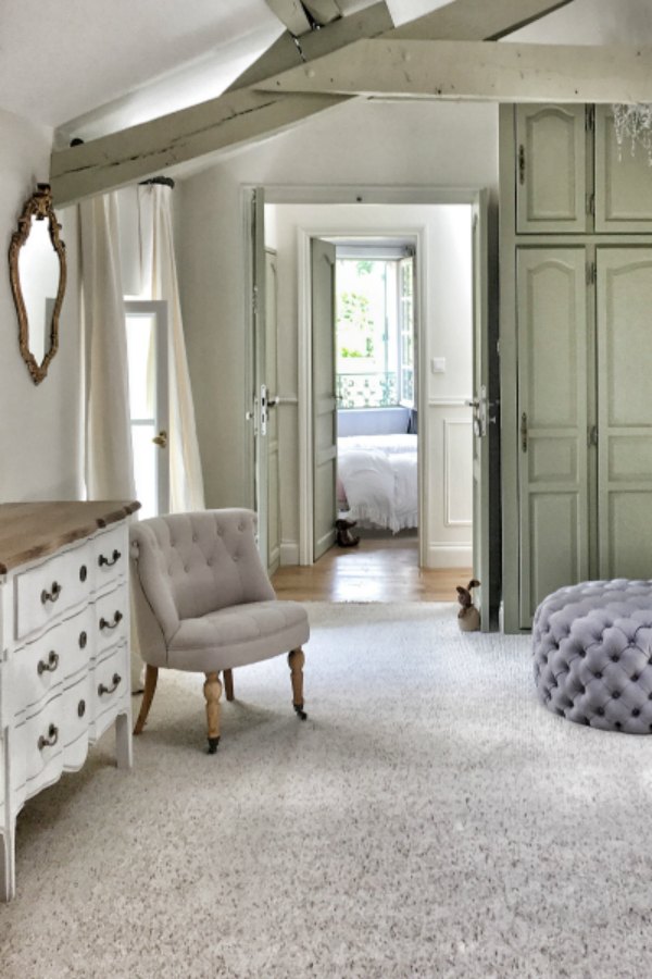 Timeless and tranquil bedroom in a renovated farmhouse in France by Vivi et Margot. Paint color on walls is Farrow & Ball Strong White. #farrowandballstrongwhite #interiordesign