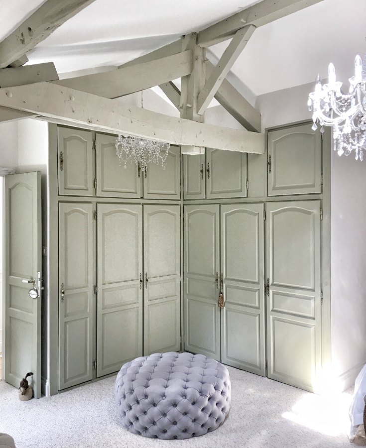 Dressing area in bedroom of a beautiful restored farmhouse in France. Cabinets are painted Farrow & Ball French Gray, and the walls are Strong White. #farrowandballfrenchgray #paintcolors