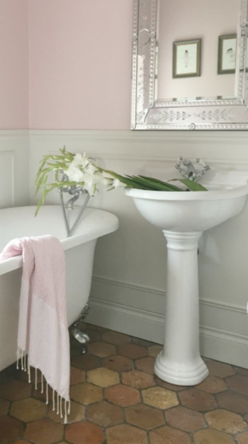 Farrow and Ball Middleton Pink in bathroom. Beautiful French farmhouse design inspiration, house tour, French homewares and market baskets from Vivi et Margot. Photos by Charlotte Reiss. Come be inspired on Hello Lovely and learn the paint colors used in these beautiful authentic French country interiors. #frenchfarmhouse #bathroomdecor #farrowandballmiddletonpink