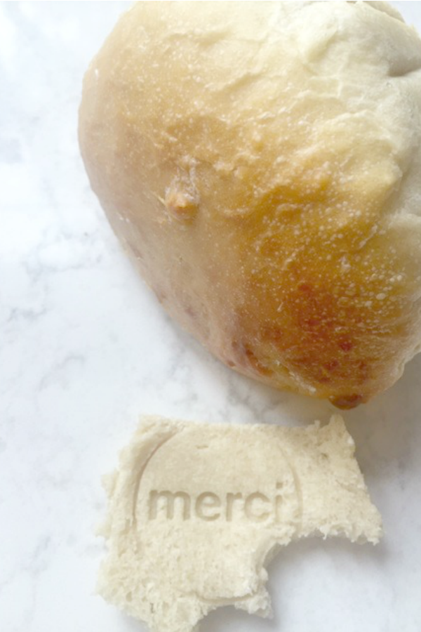 Homemade sourdough bread by Hello Lovely on a white quartz counter (Viatera Minuet).