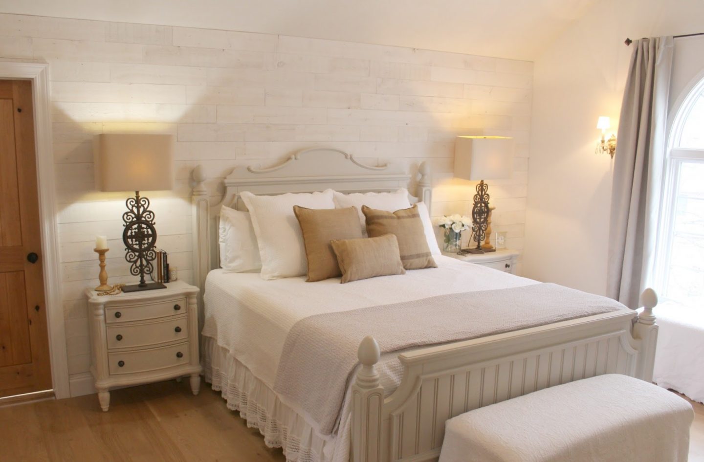 Nordic French white bedroom with light grey, linen, and white. Stikwood on wall, alder doors, cottage style furniture, and white oak flooring. #hellolovelystudio #bedroom #frenchcountry #nordicfrench #stikwood #serene #romantic #whitebedroom