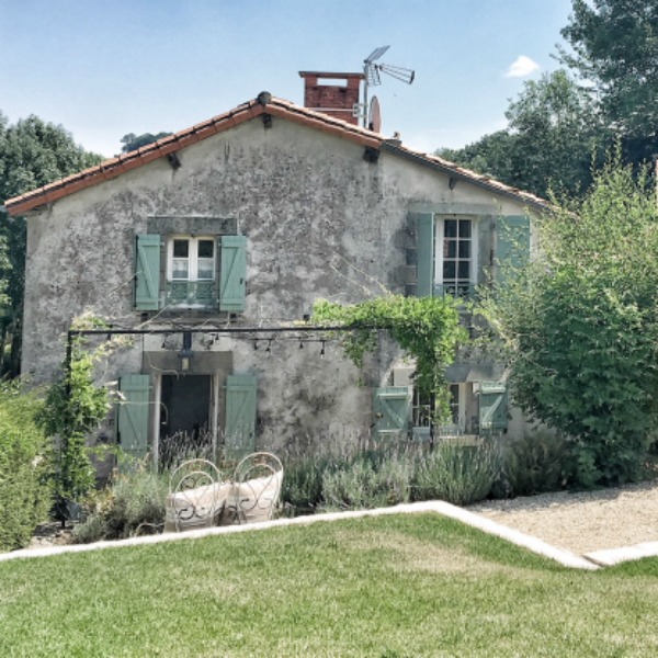 Breathtaking farmhouse exterior with green shutters. French farmhouse design inspiration, house tour, French homewares and market baskets from Vivi et Margot. Photos by Charlotte Reiss. Come be inspired on Hello Lovely and learn the paint colors used in these beautiful authentic French country interiors. #frenchfarmhouse #hellolovelystudio #frenchcountry #designinspiration #interiordesign #housetour #vivietmargot #rusticdecor #frenchhome #authentic #frenchmarket #summerliving #bordeaux #westernfrance #europeanfarmhouse