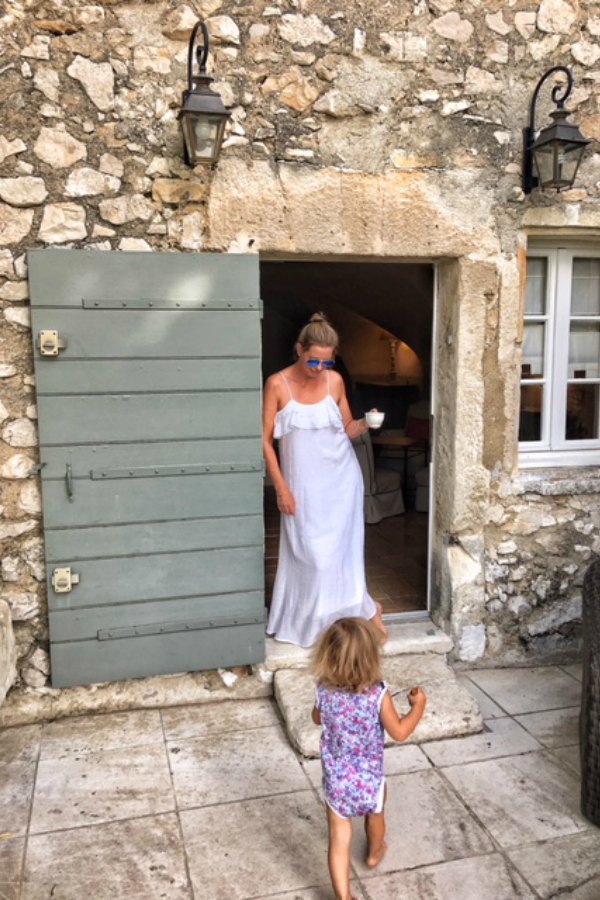 Rustic crumbling stone on a French farmhouse with green door. Vivi et Margot. #frenchfarmhouse #vivietmargot #rustic #stone #exterior #greendoor