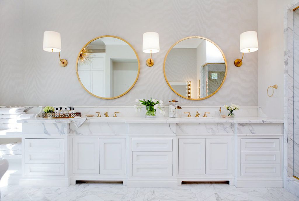 Luxurious white marble double vanity in bathroom with round mirrors. Modern Chic Home in the Southwest. E&A Builders. Pinnacle Conceptions. Jaimee Rose Interiors. #modern #French #housedesign #luxuryhome