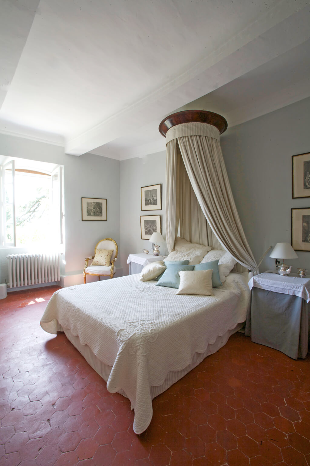 Tranquil blue walls in a French country bedroom.