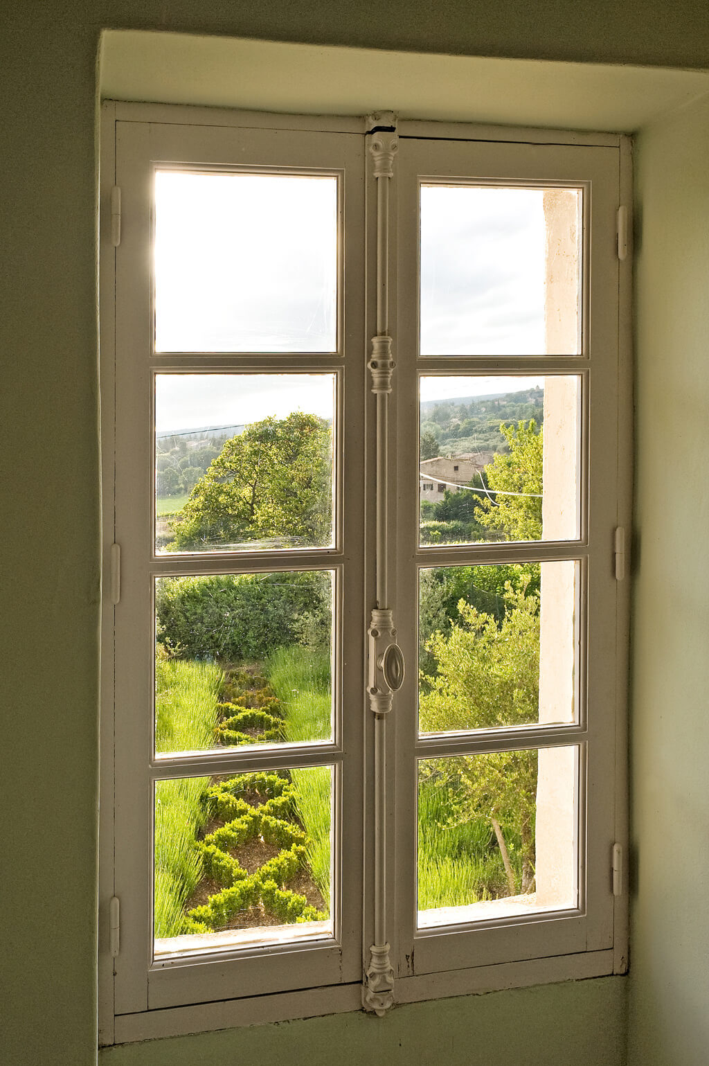 Old World window overlooking French countryside in a Provence chateau - Haven In.