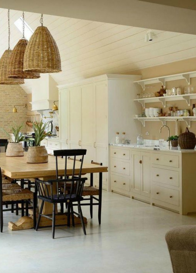 Breathtaking, elegant, and timeless English Country Kitchen Tour with design and photos by deVOL kitchens in the UK. Bespoke cabinetry, AGA stove, steel windows and doors, woven pendants, and copper accents. Interior design by Susie Atkinson.