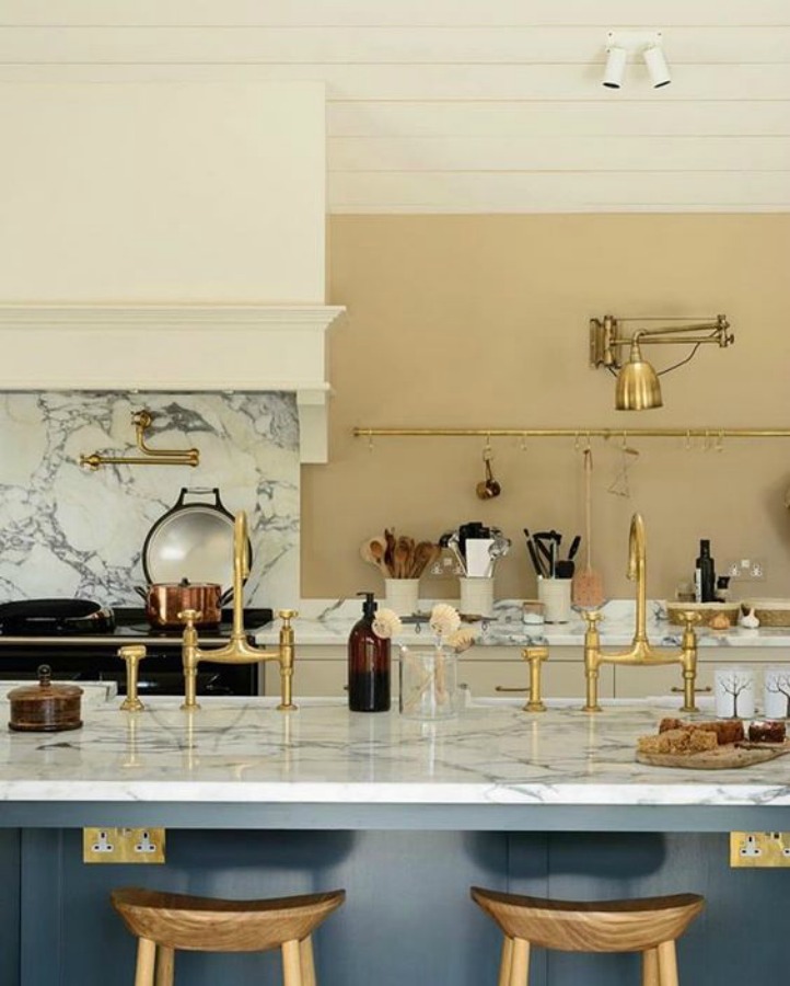 Breathtaking, elegant, and timeless English Country Kitchen Tour with design and photos by deVOL kitchens in the UK. Bespoke cabinetry, AGA stove, steel windows and doors, woven pendants, and copper accents. Interior design by Susie Atkinson.