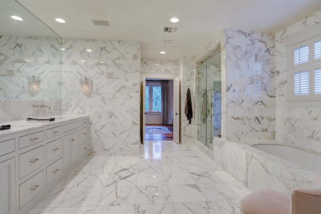 Sophisticated marble bathroom. Luxurious interior design details in a Tudor Revival house renovation in Houston. Design consultant: Pam Pierce. Many reclaimed antique materials from Chateau Domingue. #housetour #oldworld #pampierce #chateaudomingue #europeanantiques #luxurioushome #interiordesignideas #Frenchcountry #limestone #reclaimedflooring #bespoke #houstonhome