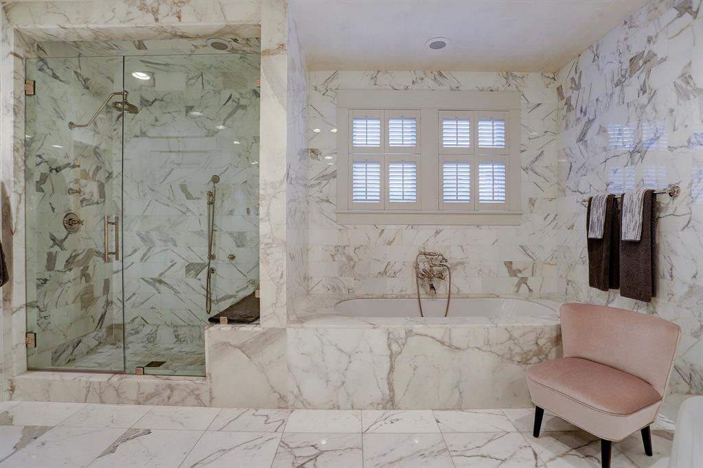 Calacatta marble bathroom. Luxurious interior design details in a Tudor Revival house renovation in Houston. Design consultant: Pam Pierce. Many reclaimed antique materials from Chateau Domingue. #housetour #oldworld #pampierce #chateaudomingue #europeanantiques #luxurioushome #interiordesignideas #Frenchcountry #limestone #reclaimedflooring #bespoke #houstonhome