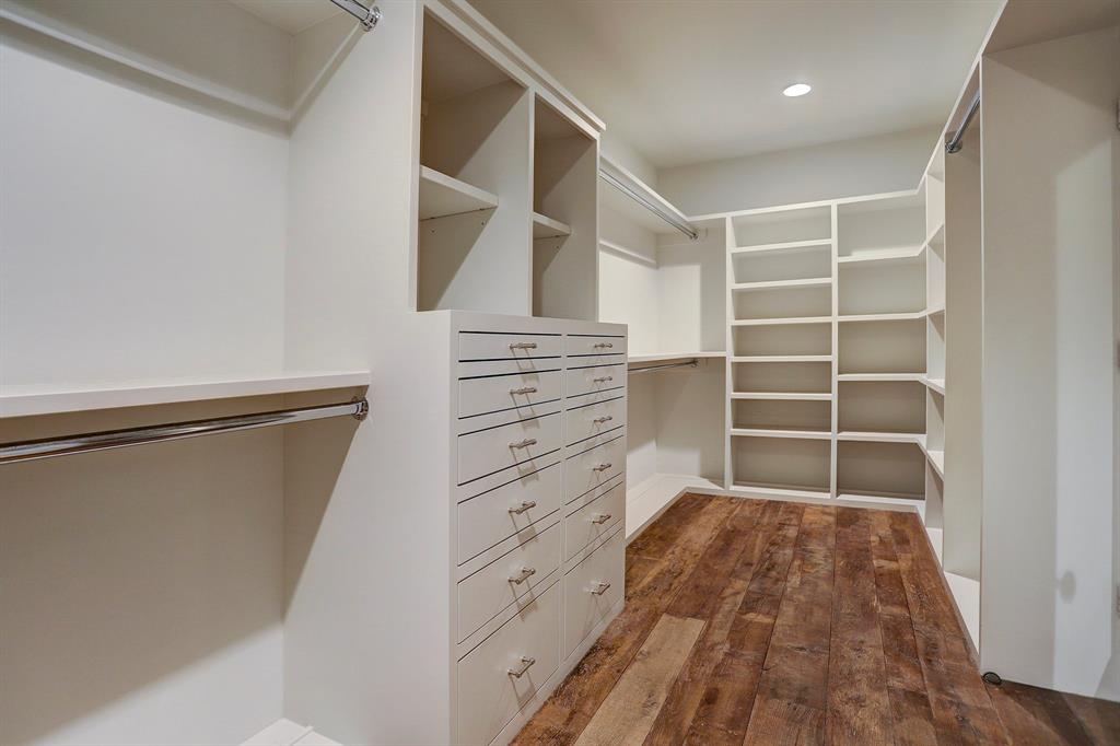 Custom closet with built-ins. Luxurious interior design details in a Tudor Revival house renovation in Houston. Design consultant: Pam Pierce. Many reclaimed antique materials from Chateau Domingue. #housetour #oldworld #pampierce #chateaudomingue #europeanantiques #luxurioushome #interiordesignideas #Frenchcountry #limestone #reclaimedflooring #bespoke #houstonhome