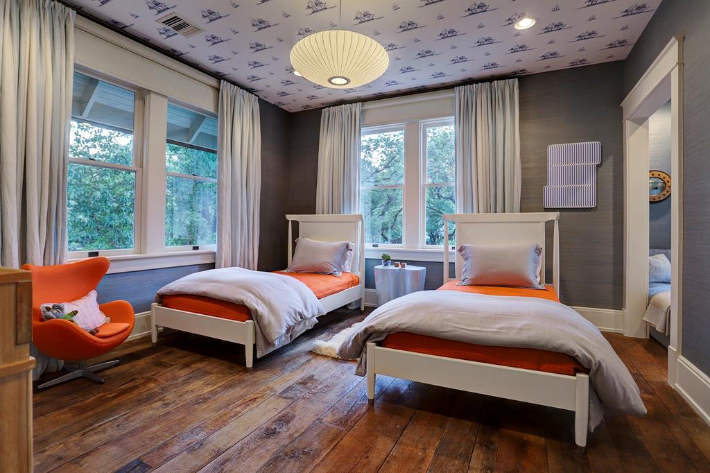 Bright orange accents in a kids bedroom. Luxurious interior design details in a Tudor Revival house renovation in Houston. Design consultant: Pam Pierce. Many reclaimed antique materials from Chateau Domingue. #housetour #oldworld #pampierce #chateaudomingue #europeanantiques #luxurioushome #interiordesignideas #Frenchcountry #limestone #reclaimedflooring #bespoke #houstonhome