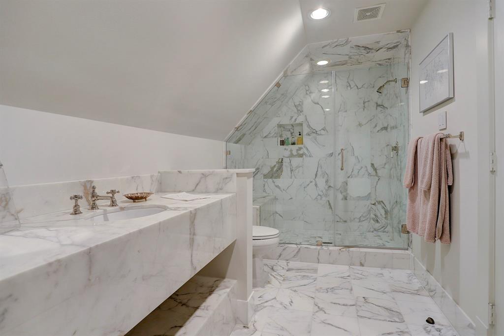 Calacatta marble bathroom. Luxurious interior design details in a Tudor Revival house renovation in Houston. Design consultant: Pam Pierce. Many reclaimed antique materials from Chateau Domingue. #housetour #oldworld #pampierce #chateaudomingue #europeanantiques #luxurioushome #interiordesignideas #Frenchcountry #limestone #reclaimedflooring #bespoke #houstonhome