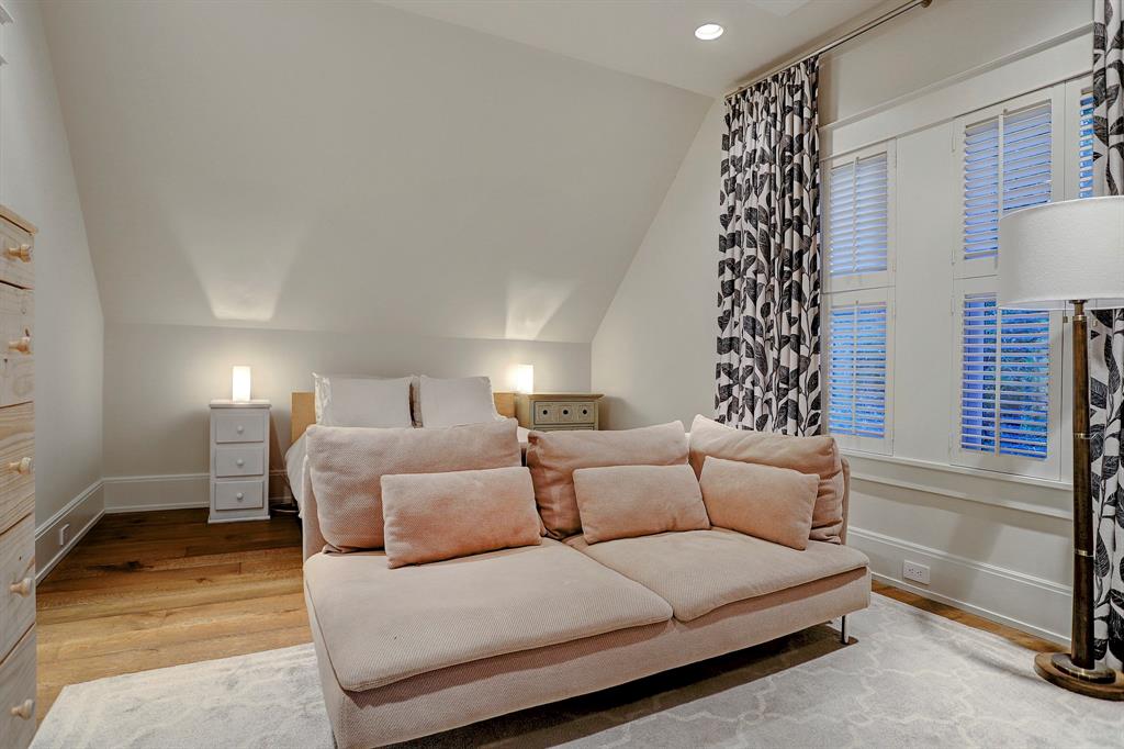 Pink velvet sofa in bedroom. Luxurious interior design details in a Tudor Revival house renovation in Houston. Design consultant: Pam Pierce. Many reclaimed antique materials from Chateau Domingue. #housetour #oldworld #pampierce #chateaudomingue #europeanantiques #luxurioushome #interiordesignideas #Frenchcountry #limestone #reclaimedflooring #bespoke #houstonhome