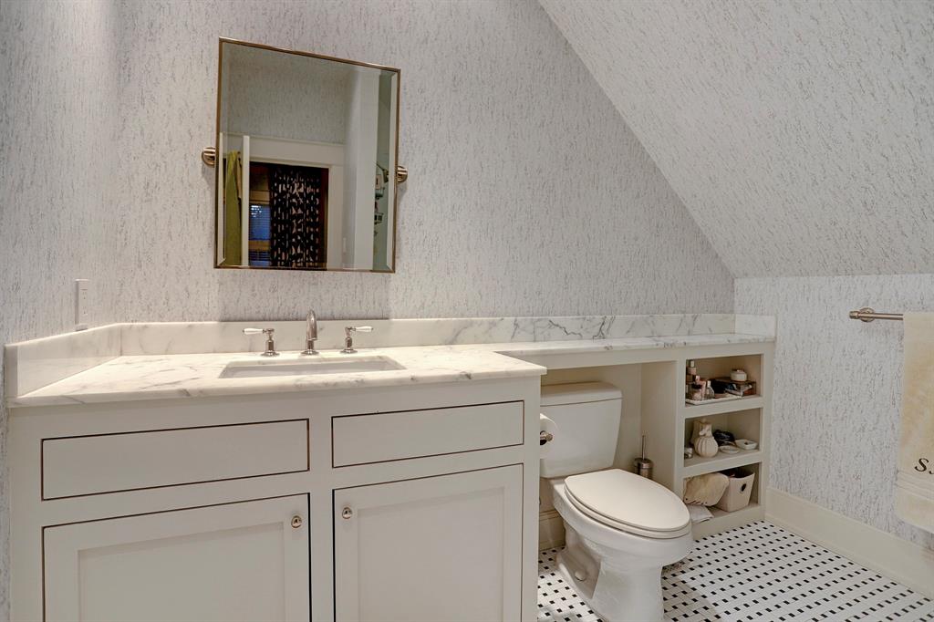 Classic white bathroom. Luxurious interior design details in a Tudor Revival house renovation in Houston. Design consultant: Pam Pierce. Many reclaimed antique materials from Chateau Domingue. #housetour #oldworld #pampierce #chateaudomingue #europeanantiques #luxurioushome #interiordesignideas #Frenchcountry #limestone #reclaimedflooring #bespoke #houstonhome