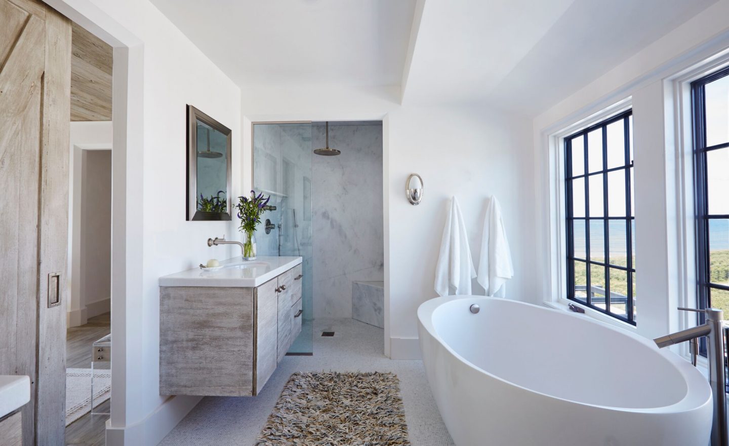 Luxurious bathroom with floating vanity. Stunning interior design and Timeless Architecture Inspiration: Jeffrey Dungan. Photo: William Abranowicz. #classicdesign #traditional #architecture #jeffreydungan #sophisticateddesign #architect