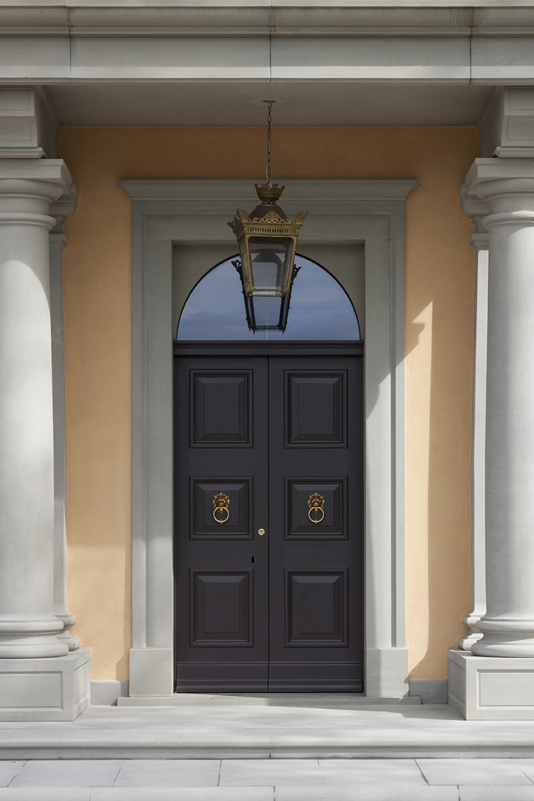 Front doors at entrance. After: renovation of a Tuscan villa by Artichoke.