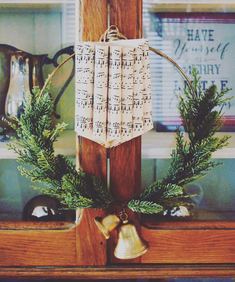Nostalgic hoilday decor with wreath, sheet music, and bells - Corner French Cottage.