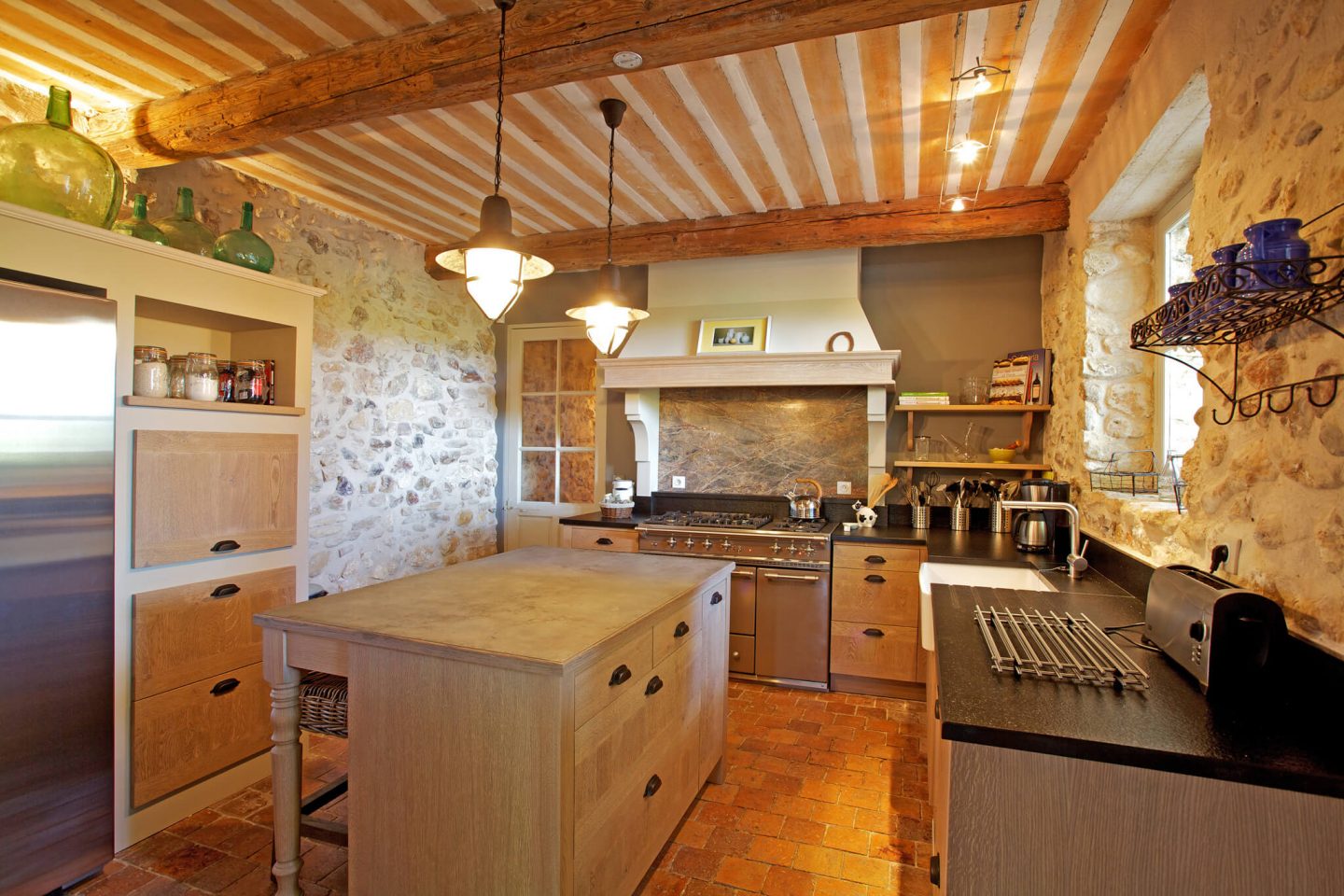 Come discover rustic elegance, ancient stone, and beautiful rugged beams within a Provencal villa - then stay for the paint color and decor Ideas! #frenchcountry #oldworld #interiordesign #provence