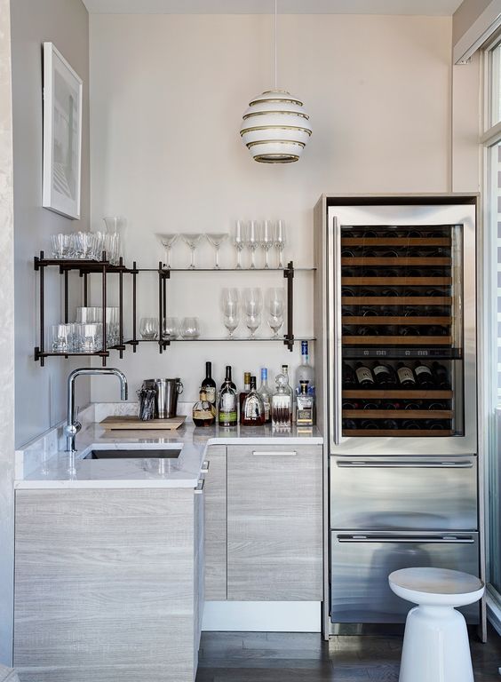 Dreamy bar area in a home. Beautiful interior design inspiration from Chicago designer Cari Giannoulias on Hello Lovely Studio. #hellolovelystudio #interiordesign #carigiannoulias #chicagodesigner #interiordesigner #sophisticateddecor #understated #luxurydecor