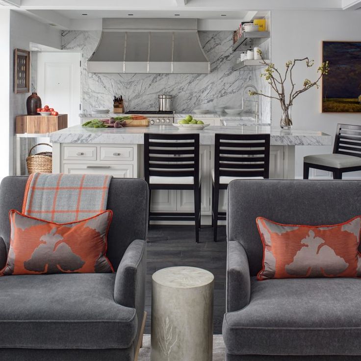 Luxurious marble kitchen open to living area. Beautiful interior design inspiration from Chicago designer Cari Giannoulias on Hello Lovely Studio. #hellolovelystudio #interiordesign #carigiannoulias #chicagodesigner #interiordesigner #sophisticateddecor #understated #luxurydecor