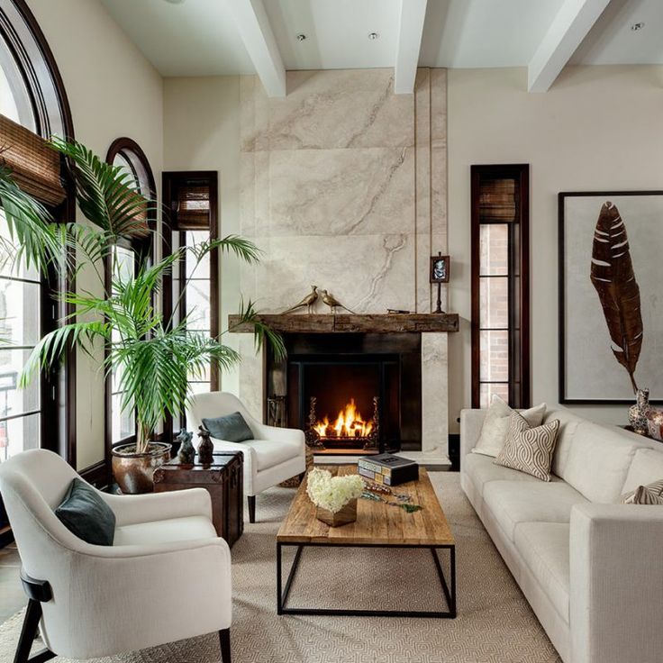 Living room with tropical exotic accents and ivory by Cari Giannoulias.