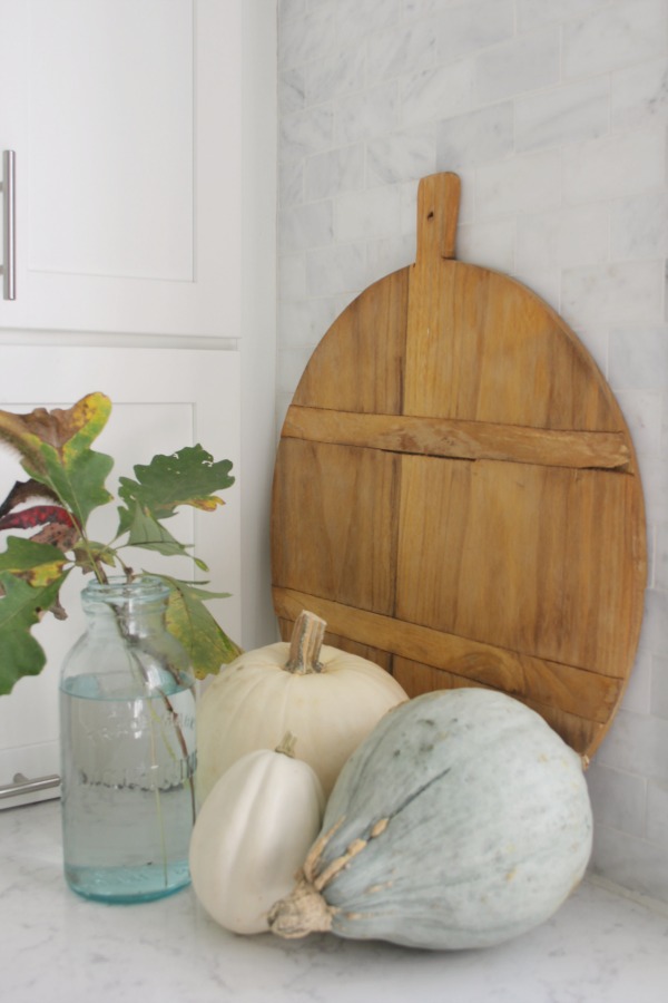 Pastel and white fall decor in my kitchen which has a relaxed, European country and shabby chic vibe. See more of it on my blog Hello Lovely where you'll see my style is serene and peaceful. #hellolovelystudio #falldecor #pastels #serenedecor #whitedecor #europeancountry #farmhousestyle #frenchfarmhouse #pumpkins