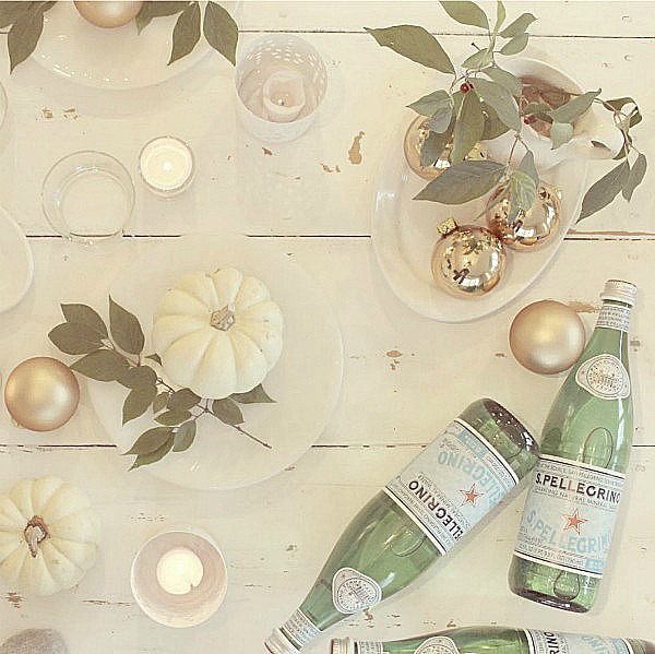 Romantic and serene white farmhouse tablescape with shabby chic vintage style and European inspired charm. Blush roses, white ironstone, candlelight, and fresh greenery are a few of the ingredients. Hello Lovely Studio. #hellolovelystudio #tablescape #whitedecor #frenchfarmhouse #tabledecor #shabbychic #romanticdecor #frenchcountry #placesetting