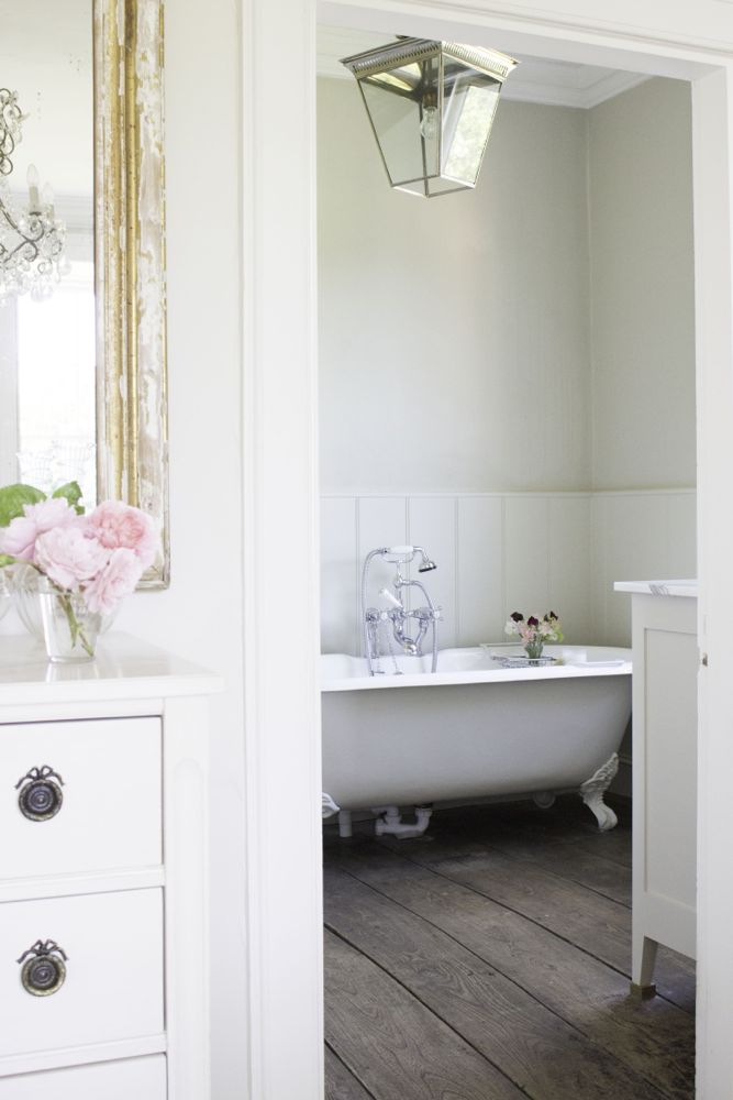 Multiple shades of white mix for a glorious cloud-like interior. Scandinavian style white Nordic French design details as well as spare decor style meet English countryside charm in "The Hatch," a photographic location in Wiltshire. Design: Atlanta Bartlett & Dave Coote of the Beach Studios. #livingroom #scandinavian #interiordesign #whitedecor #frenchnordic #nordicFrench #Swedishstyle #serene #shabbychic