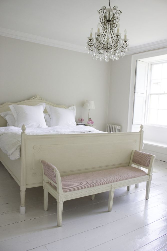 Multiple shades of white mix for a glorious cloud-like interior. Scandinavian style white Nordic French design details as well as spare decor style meet English countryside charm in "The Hatch," a photographic location in Wiltshire. Design: Atlanta Bartlett & Dave Coote of the Beach Studios. #livingroom #scandinavian #interiordesign #whitedecor #frenchnordic #nordicFrench #Swedishstyle #serene #shabbychic