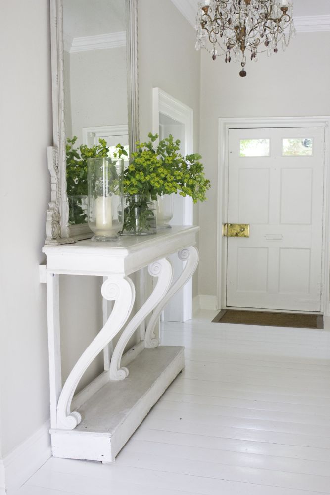 Multiple shades of white mix for a glorious cloud-like interior. Scandinavian style white Nordic French design details as well as spare decor style meet English countryside charm in "The Hatch," a photographic location in Wiltshire. Design: Atlanta Bartlett & Dave Coote of the Beach Studios. #livingroom #scandinavian #interiordesign #whitedecor #frenchnordic #nordicFrench #Swedishstyle #serene #shabbychic