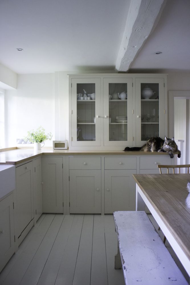 Multiple shades of white mix for glorious cloud-like Country French Nordic White Interiors. Scandinavian style white Nordic French design details as well as spare decor style meet English countryside charm in "The Hatch," a photographic location in Wiltshire. Design: Atlanta Bartlett & Dave Coote of the Beach Studios. #livingroom #scandinavian #interiordesign #whitedecor #frenchnordic #nordicFrench #Swedishstyle #serene #shabbychic