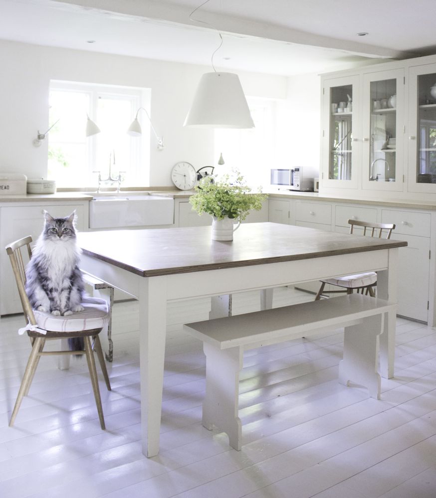 English country kitchen with harvest table and Maine Coon cat - Atlanta Bartlett of Beach Studios.