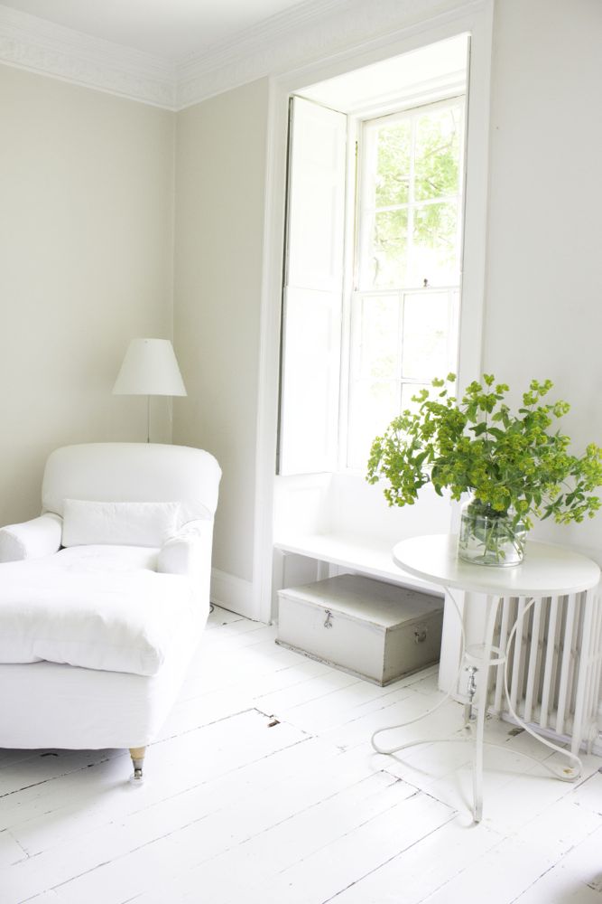 Multiple shades of white mix for glorious cloud-like Country French Nordic White Interiors. Scandinavian style white Nordic French design details as well as spare decor style meet English countryside charm in "The Hatch," a photographic location in Wiltshire. Design: Atlanta Bartlett & Dave Coote of the Beach Studios. #livingroom #scandinavian #interiordesign #whitedecor #frenchnordic #nordicFrench #Swedishstyle #serene #shabbychic