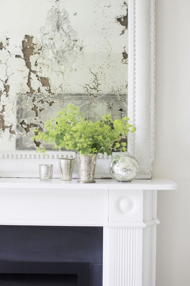 Multiple shades of white mix for glorious cloud-like Country French Nordic White Interiors. Scandinavian style white Nordic French design details as well as spare decor style meet English countryside charm in "The Hatch," a photographic location in Wiltshire. Design: Atlanta Bartlett & Dave Coote of the Beach Studios. #livingroom #scandinavian #interiordesign #whitedecor #frenchnordic #nordicFrench #Swedishstyle #serene #shabbychic