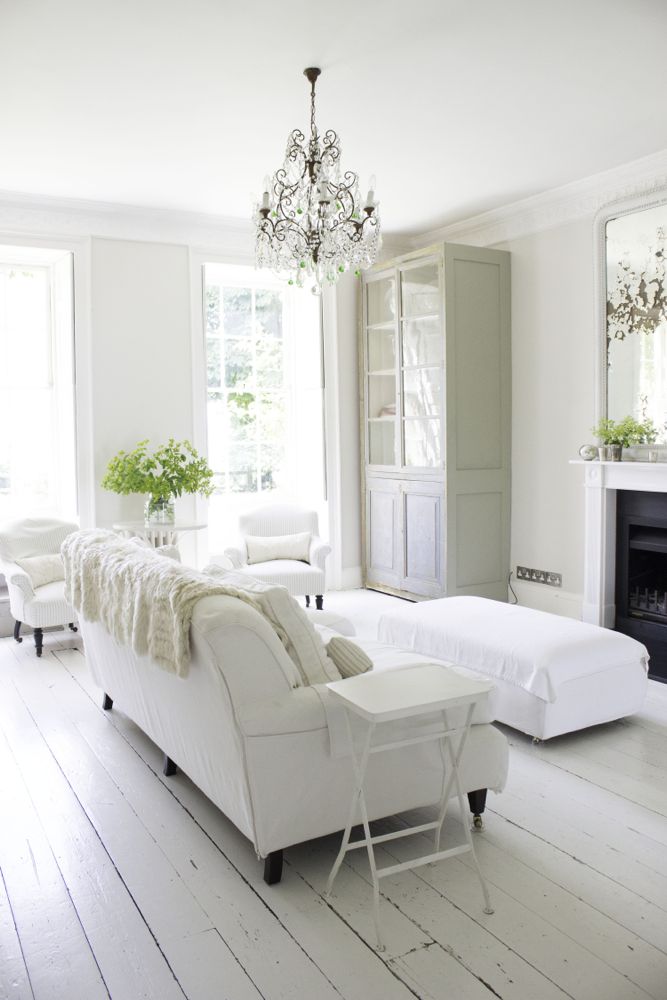 Multiple shades of white mix for glorious cloud-like Country French Nordic White Interiors. Scandinavian style white Nordic French design details as well as spare decor style meet English countryside charm in "The Hatch," a photographic location in Wiltshire. Design: Atlanta Bartlett & Dave Coote of the Beach Studios. #livingroom #scandinavian #interiordesign #whitedecor #frenchnordic #nordicFrench #Swedishstyle #serene #shabbychic