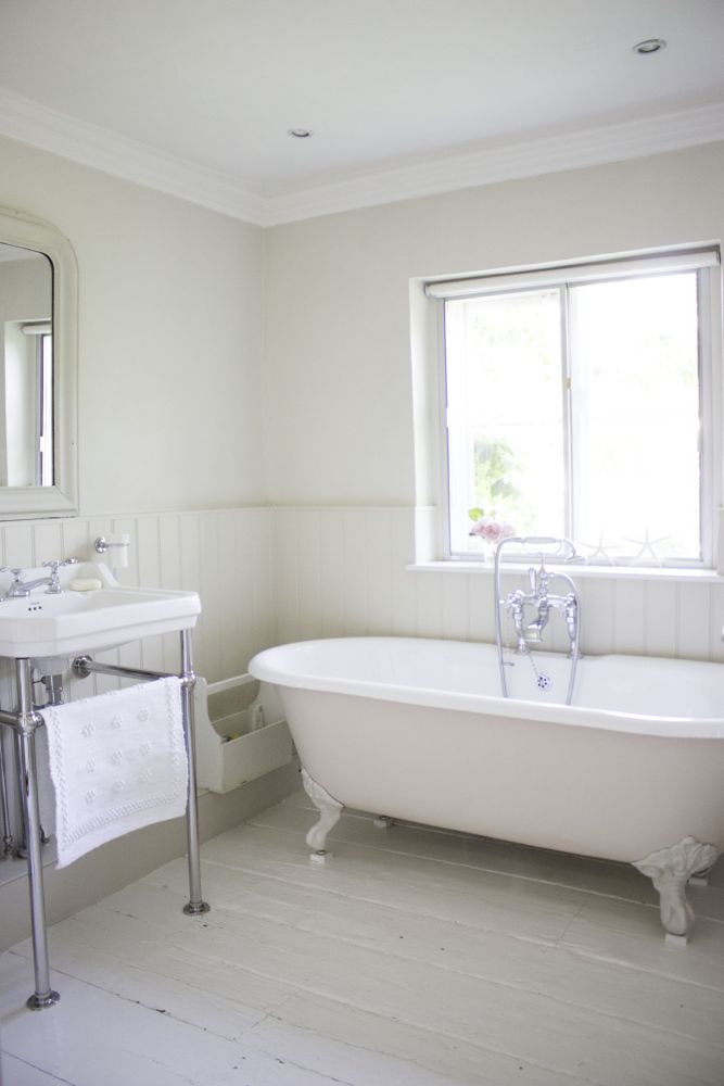 Multiple shades of white mix for glorious cloud-like Country French Nordic White Interiors. Scandinavian style white Nordic French design details as well as spare decor style meet English countryside charm in "The Hatch," a photographic location in Wiltshire. Design: Atlanta Bartlett & Dave Coote of the Beach Studios. #livingroom #scandinavian #interiordesign #whitedecor #frenchnordic #nordicFrench #Swedishstyle #serene #shabbychic