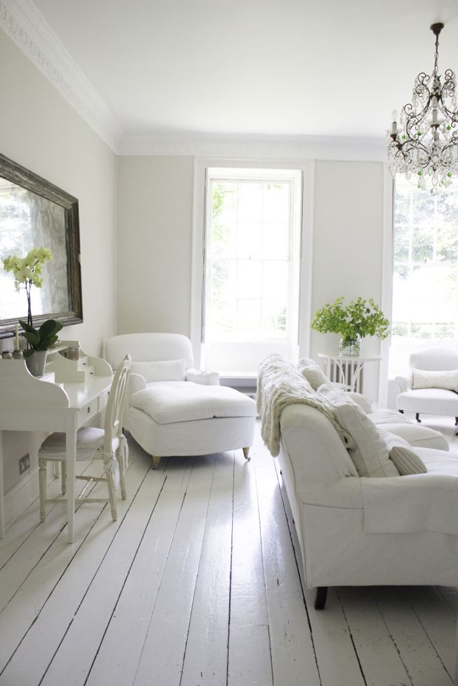 Multiple shades of white mix for glorious cloud-like Country French Nordic White Interiors. Scandinavian style white Nordic French design details as well as spare decor style meet English countryside charm in "The Hatch," a photographic location in Wiltshire. Design: Atlanta Bartlett & Dave Coote of the Beach Studios. #livingroom #scandinavian #interiordesign #whitedecor #frenchnordic #nordicFrench #Swedishstyle #serene #shabbychic