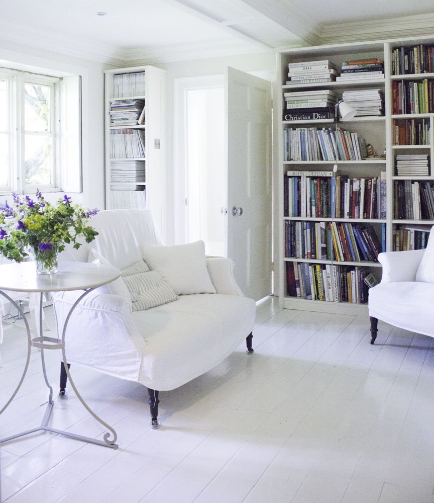Multiple shades of white mix for glorious cloud-like Country French Nordic White Interiors. Scandinavian style white Nordic French design details as well as spare decor style meet English countryside charm in "The Hatch," a photographic location in Wiltshire. Design: Atlanta Bartlett & Dave Coote of the Beach Studios. #livingroom #scandinavian #interiordesign #whitedecor #frenchnordic #nordicFrench #Swedishstyle #serene #shabbychic
