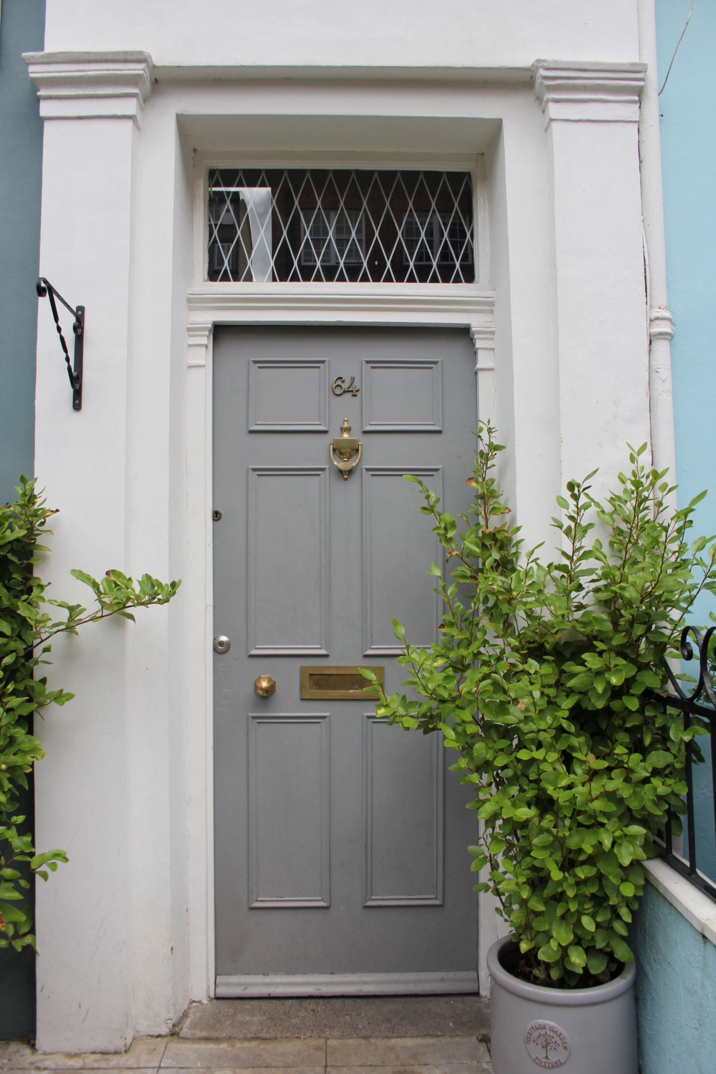 Grey painted front door in London. Hello Lovely Studio. Come tour these gorgeous front doors in Notting Hill and Holland Park...certainly lovely indeed. Curb appeal and Paint Color Inspiration. Lovely London Doors & Paint Color Ideas!